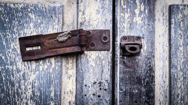 Vintage rustic old lock on painted door