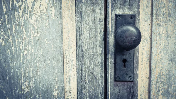 Vintage rustic old lock on painted door