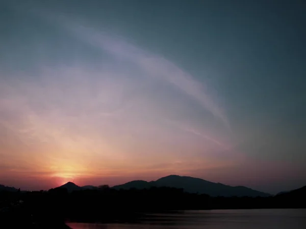 Mountain range at sunset, Lake. View on Mountain Lake in front of mountain range,