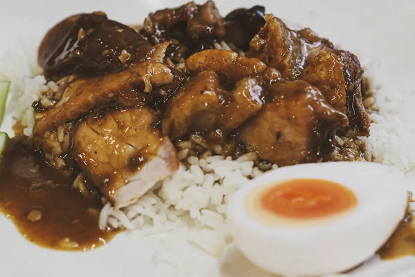 Roasted red pork. Barbecued red pork in sauce with rice. Barbecued red pork in sauce with rice, Chinese style roasted pork.