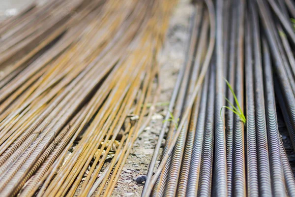 stack of straight old rusty high yield stress deformed reinforcement steel or iron bars.construction work.structure work