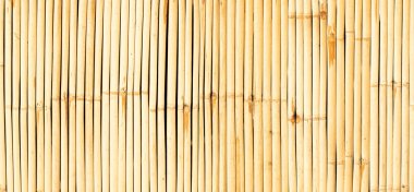 Sarı duvar bambusunun kusursuz arka planı. Geleneksel kültür yaşam tarzı için doğa ahşap malzeme