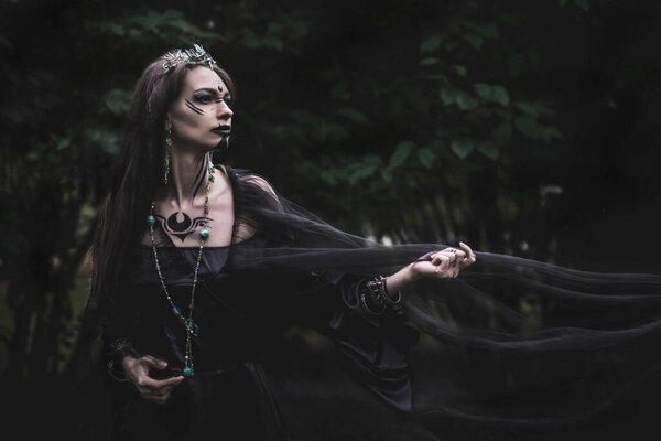 Girl in a gothic gloomy image in a lilac