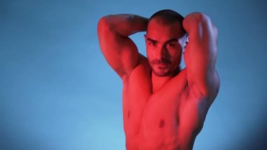 Muscular And Sexy Torso Of Young Man, Bodybuilder Isolated on Blue Background