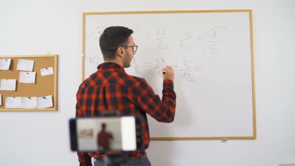 Online mathematics teacher in red shirt teaching — Stock Video