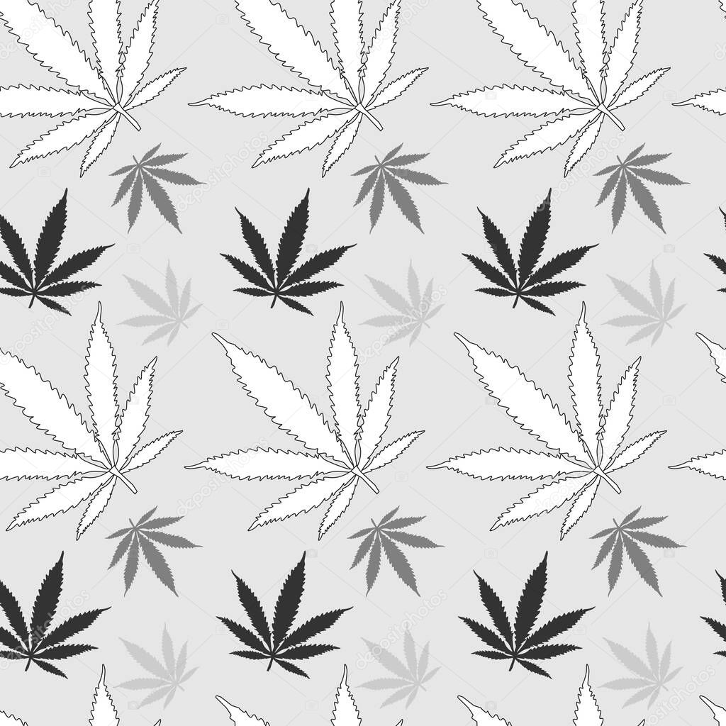 monochrome seamless pattern of cannabis leaves in white light gray and dark gray on a light background