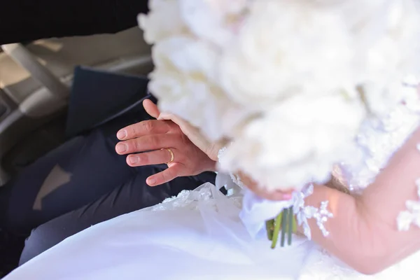 the bride and groom keep their hands