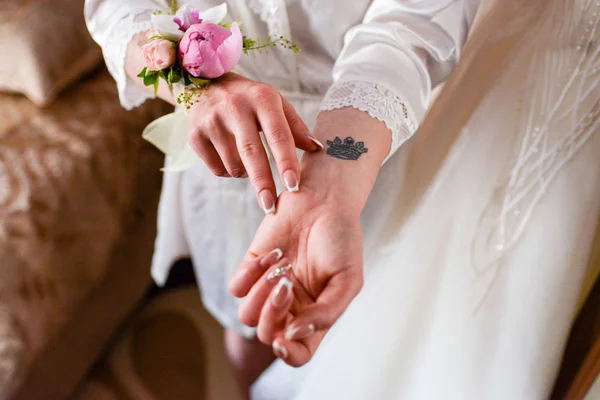 bride with tattoo hands