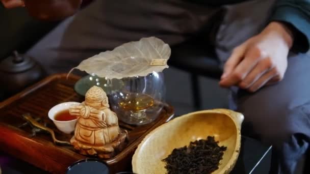 Man Pours Tea Sieve — Stock Video