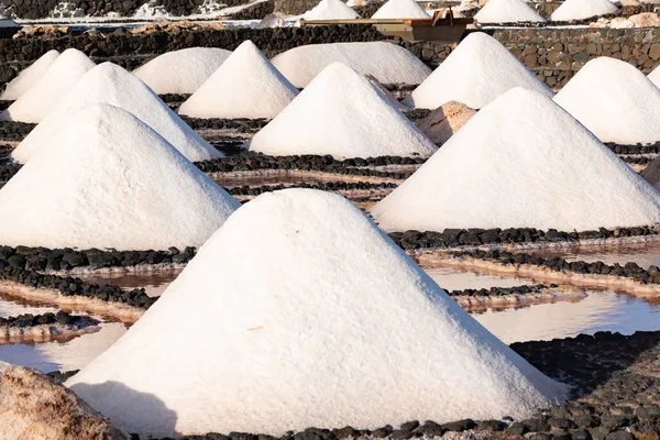 Salt piles on a saline exploration in salt factory refinery mines Janubio, Lanzarote, Canary Islands, Spain