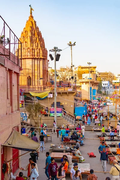 Varanasi, India, Mar 10 2019 - Dashwamedh Ganges river ghat at at night with ancient architecture and illuminated street shops at Varanasi India — стоковое фото