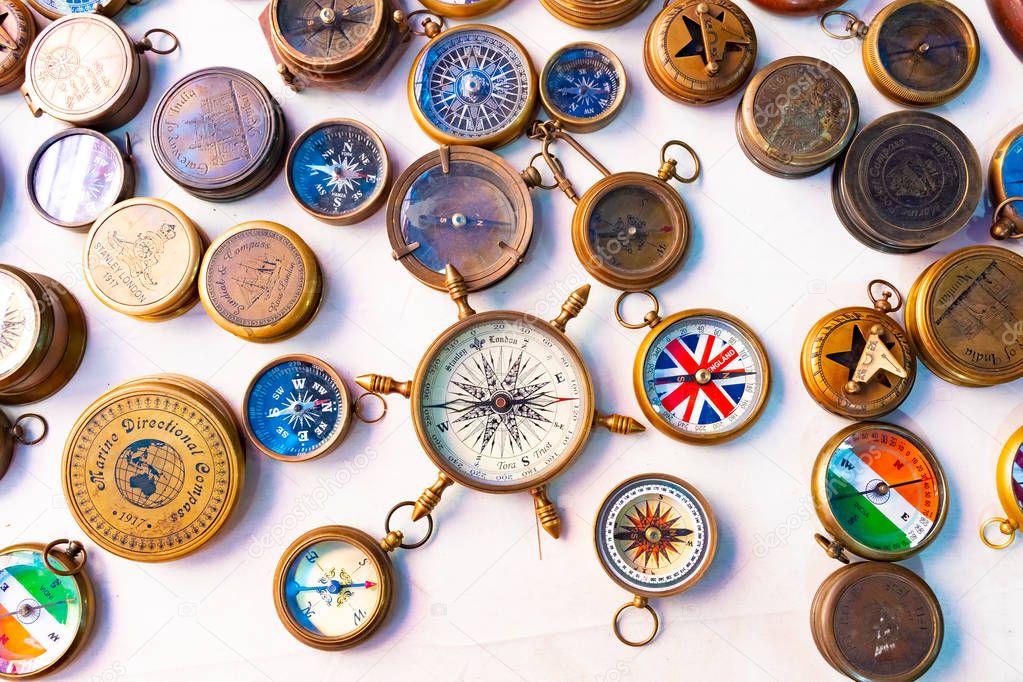 Beautiful and colorful vintage compasses, travel background