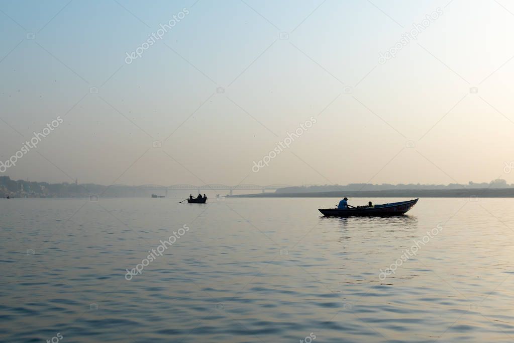 Varanasi, India, 27 Mar 2019 -  Dashaswamedh Ganges river ghat Varanasi at twilight with tourists enjoying boating rides