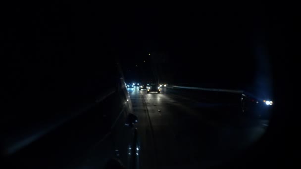 Back mirrow Night traffic chasing or run away , a lot of cars driving slowly — Stock Video