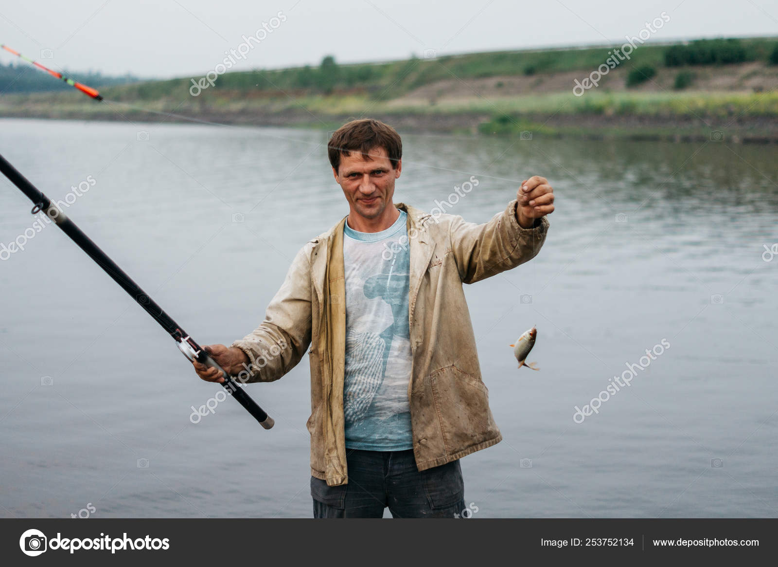 Man Caught Fish Fisherman Caught Small Fish Stock Photo by ©svbalan  253752134