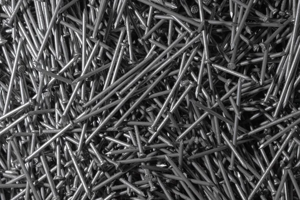金属釘 テクスチャ 多くの新しい長い鉄の釘 壁紙の背景 — ストック写真
