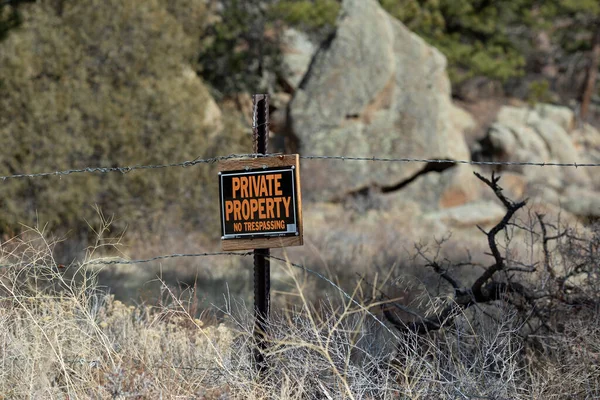 A Private Property sign posted in the back country
