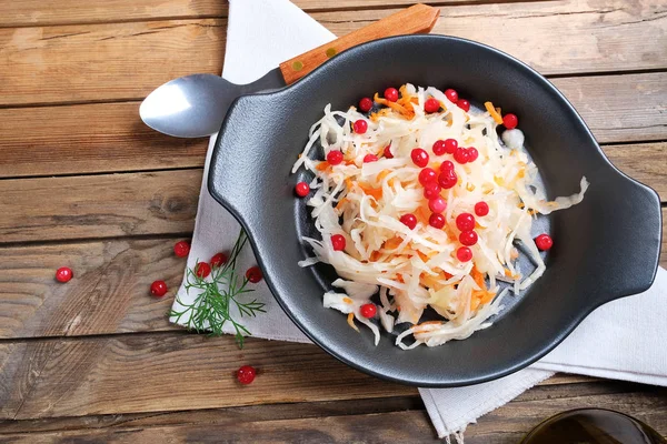 Pickled canned shredded cabbage and carrots with cranberries as