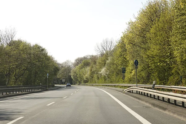 Empty road with trees Driving from Olfen to Dorsten road tripp backgrounds wallpapers in high quality fine art prints. Driving from Olfen to Dorsten road tripp backgrounds wallpapers in high quality f — Stock Photo, Image