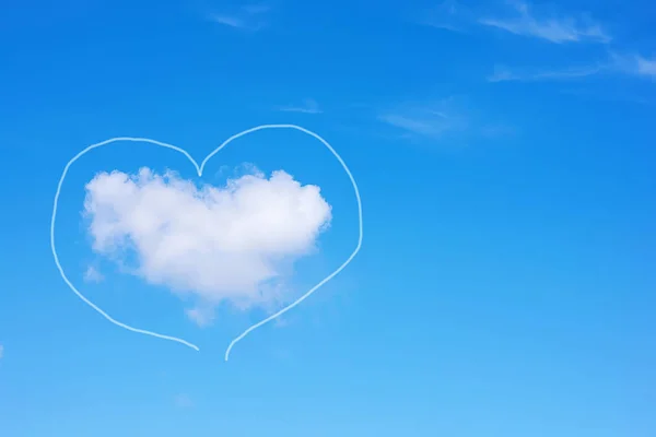 Heart-shaped cloud on a blue sky. Copy space. Concept of love, romance and valentines day