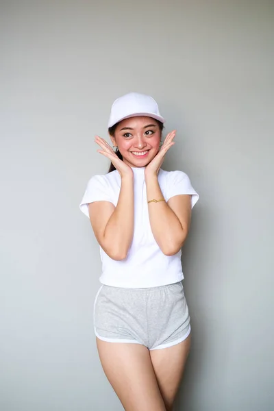 Asian Dziewczyna w Sportswear z szczęśliwy Expression. Obrazek Stockowy