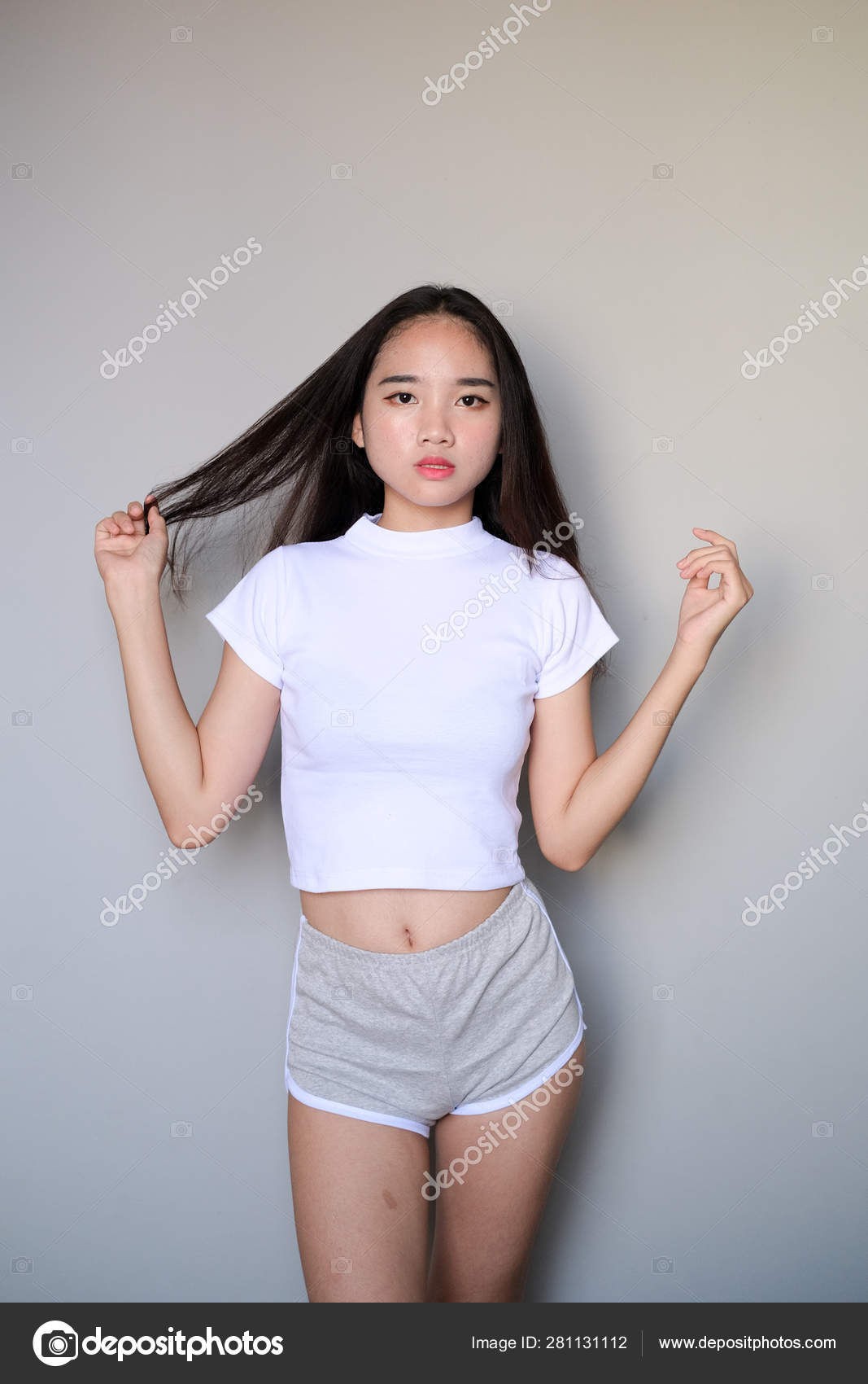 Asian girl wearing sportswear attire shots body length. Stock Photo by  ©mkqayyum@gmail.com 281131112