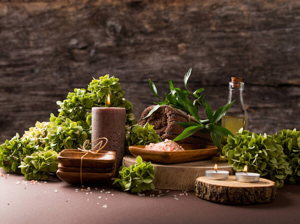 spa massage setting product, oil on wooden background, Vlaentine day background