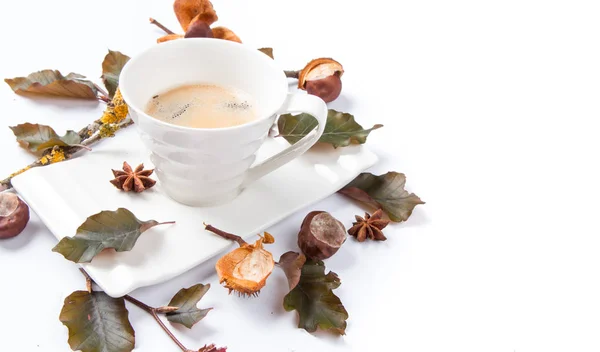 Autumn composition. Cup of coffee and leaves on white background. Flat lay, top view, copy space Autumn