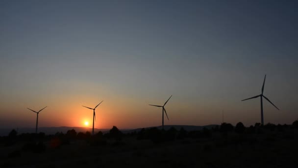 Two windmills and the orange sun — Stock Video