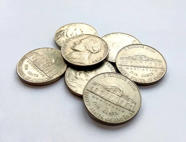 Close up photo of American five cent coins usa on white background