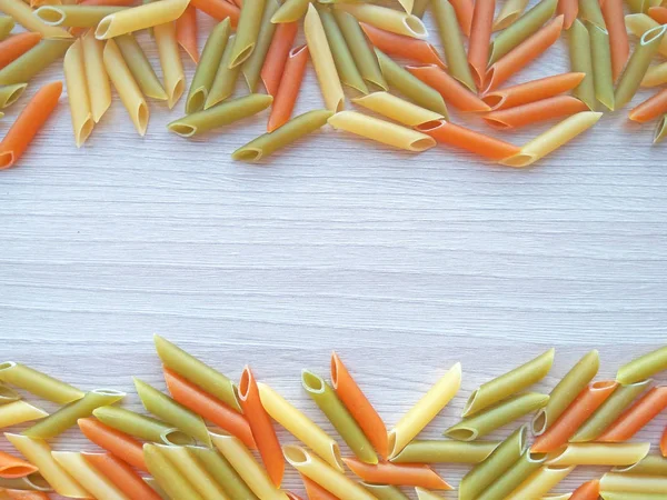 Textured Italian Food Background Colorful Uncooked Penne Pasta Wooden Table — Stock Photo, Image