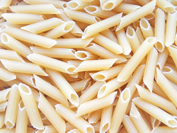 Texturerat Italiensk Mat Bakgrund Okokt Penne Pasta Top Visa Platt — Stockfoto