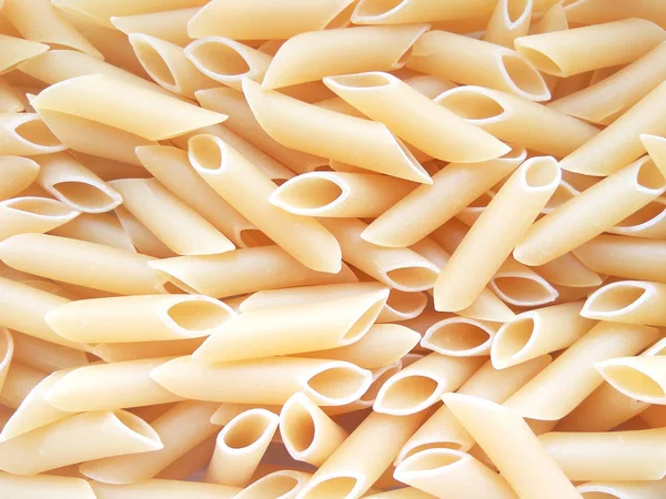 Texturerat Italiensk Mat Bakgrund Okokt Penne Pasta Top Visa Platt — Stockfoto