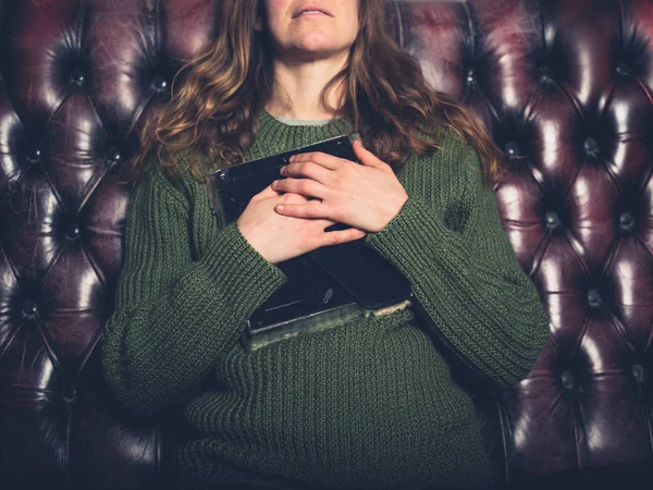 Sad Young Woman Sofa Clutching Picture Frame — Stock Photo, Image