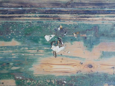 Bir ahşap yüzeyde lapa lapa boya