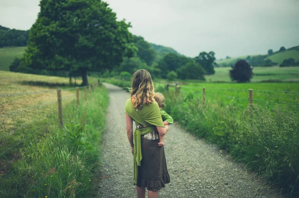 Young Mother Standing Country Road Her Toddler Carrier Sling — Stock Photo, Image