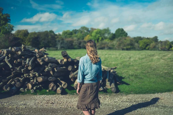 Young Woman Standing Pile Logs Forest Autumn — Stock Photo, Image