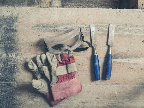 Pair Workman Gloves Two Chisels Pair Protective Goggles Wooden Floor — Stock Photo, Image