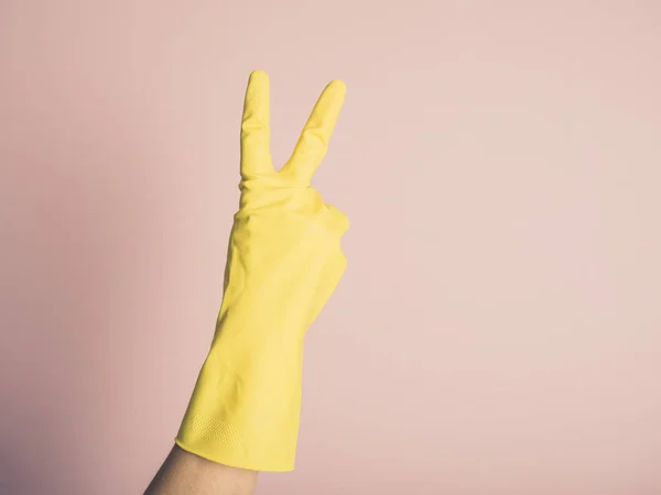 Female Hand Wearing Yellow Rubber Glove Displaying Rude Gesture — Stock Photo, Image