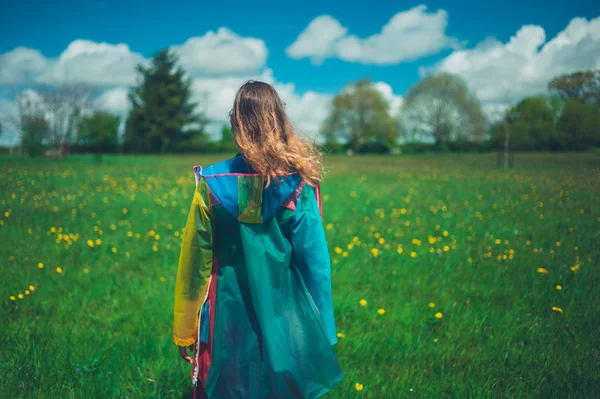 Rear View Young Woman Wearing Raincoat Standing Meadow Suny Day — Stock Photo, Image