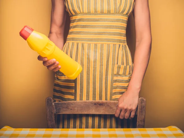 Young Woman Standing Table Bottle Household Cleaner — Stock Photo, Image
