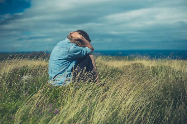 Sad Woman Sitting Field Windy Day — Stock Photo, Image