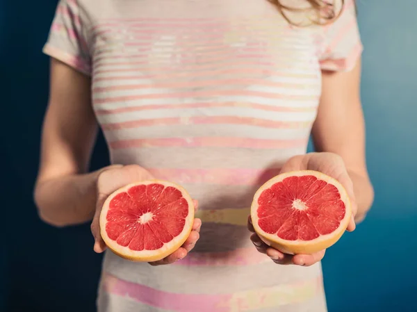 Young Woman Holding Her Big Juicy Grapefruits — Stock Photo, Image