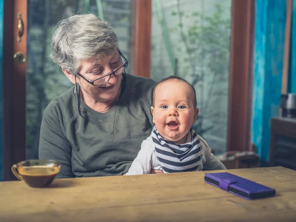 Grandmother Sitting Dining Table Her Baby Grandchild — Stock Photo, Image