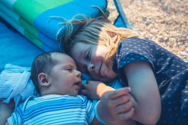 Little Preschooler Boy Lying Beach Shelter His Baby Brother — Stock Photo, Image