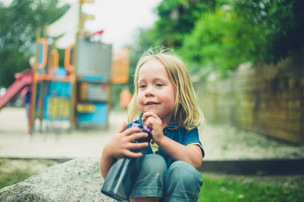 Little Preschooler Sitting Playground Water Bottle — Stock Photo, Image