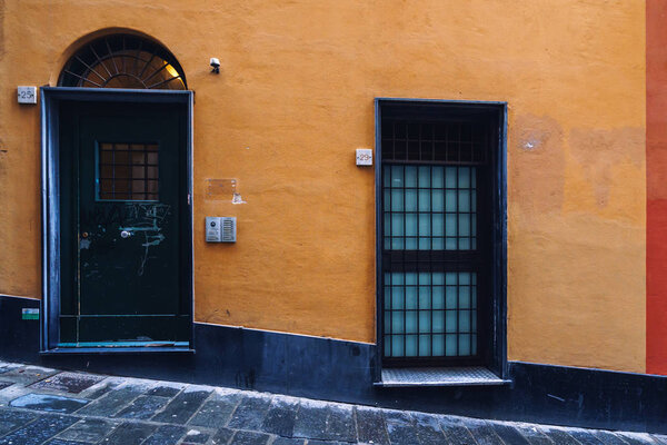 GENOA, ITALY - NOVEMBER 04, 2018 - Narrow streets of the old city with the doors