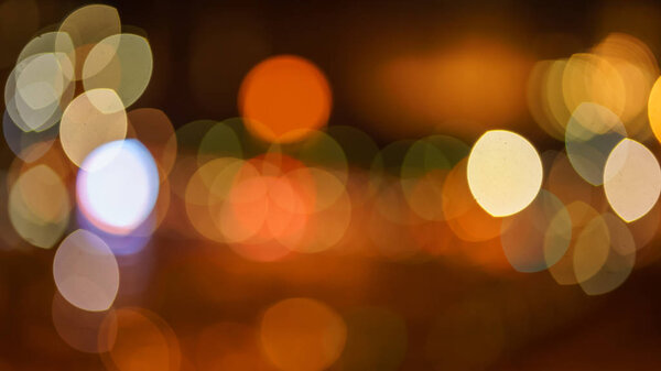 Abstract blurred blue, orange and yellow bokeh lights background