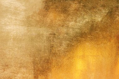 Altın soyut arkaplan veya doku ve gradyan gölgesi.
