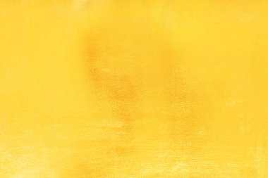 Altın arka arka plan veya doku pürüzsüz ve degradeler gölge. Yumuşak odak.